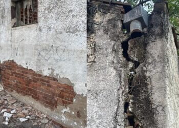 Rachaduras e pedaços do muro se soltando provocam preocupação em quem circula na calçada