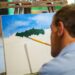 Sem movimentos no tronco, pernas e braços, artista encontrou na boca um caminho para expressar sua arte. Fotos Divulgação
