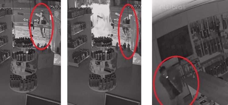 O ataque: homem se aproxima com uma pedra e arremessa contra a vidraça, que explode; a seguir, ingressa na loja com cigarro na boca e leva objetos e valores. Reprodução