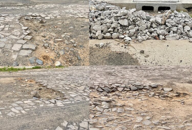 Buracos, crateras, pedras soltas, entulho... Cenário em rua no bairro Operário.