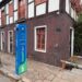 Cenário desfigurado: a histórica Casa Schmitt-Presser ofuscada pelo totem com neon